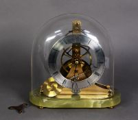‘DUNHILL' SMALL 2OTH CENTURY BRASS SKELETON CLOCK, with silvered chapter ring, on green onyx base, 8