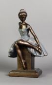 HEAVY BRONZE EFFECT RESIN FIGURE of a seated ballerina, by Sergey Eylanbetov for Alva, 1997, on