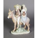 LLADRO, Spanish porcelain group of a boy and girl riding on a donkey, on oval base, 7 ½” (19 cm) H