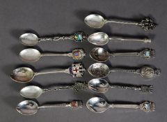 SCOTTISH SILVER SOUVENIR TEASPOON WITH THISTLE PATTERN TOP, together with NINE FOREIGN SILVER