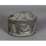 NINETEENTH CENTURY LEAD TOBACCO BOX AND COVER, of elliptical form, the sides embossed with