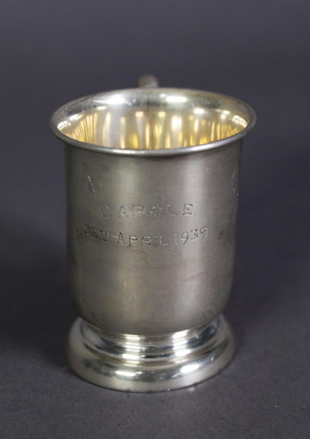GEORGE VI SILVER CHRISTENING MUG BY EDWARD VINER, of footed cylindrical form with loop handle,