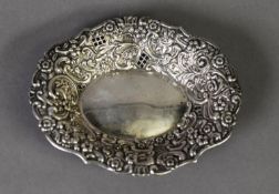EDWARD VII PIERCED AND EMBOSSED SILVER BON BON DISH BY WALKER & HALL, of oval form with floral and C
