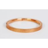 9ct GOLD HOLLOW BANGLE with engine turned flat top, 3 1/4in (8.5cm) overall diameter, Birmingham