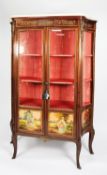 LOUIS XVI STYLE MAHOGANY VITRINE, with glazed concave sides, two glazed doors, the four lower panels