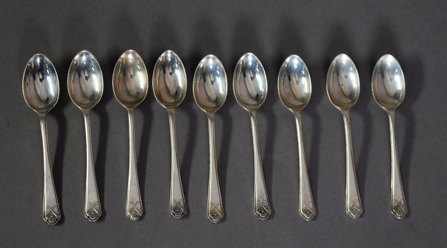 GEORGE V SET OF NINE SILVER ‘GOLF’ PRIZE TEASPOONS, Sheffield 1932 and 1933, (9), 3.9ozt