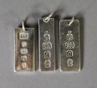 THREE SILVER INGOT PATTERN OBLONG PENDANTS each bearing the Queen's Silver Jubilee hallmark 1977,