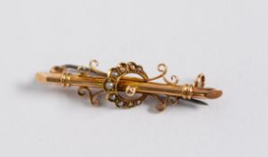 15ct GOLD BAR BROOCH, the centre overlaid with a crescent set with seed peals flanked by scrolls,