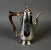 GEORGE II ARMORIAL CRESTED SILVER COFFEE POT AND COVER BY AYME VIDEAU, of tapering, footed form with
