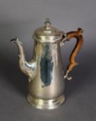 GEORGIAN STYLE SILVER COFFEE POT BY C J VANDER Ltd, of tapering, footed form with double scroll