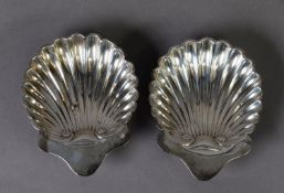 EDWARD VII PAIR OF SHELL SHAPED SILVER BUTTER DISHES, each with ball feet, 5 ¼” x 4 ¼” (13.3cm x