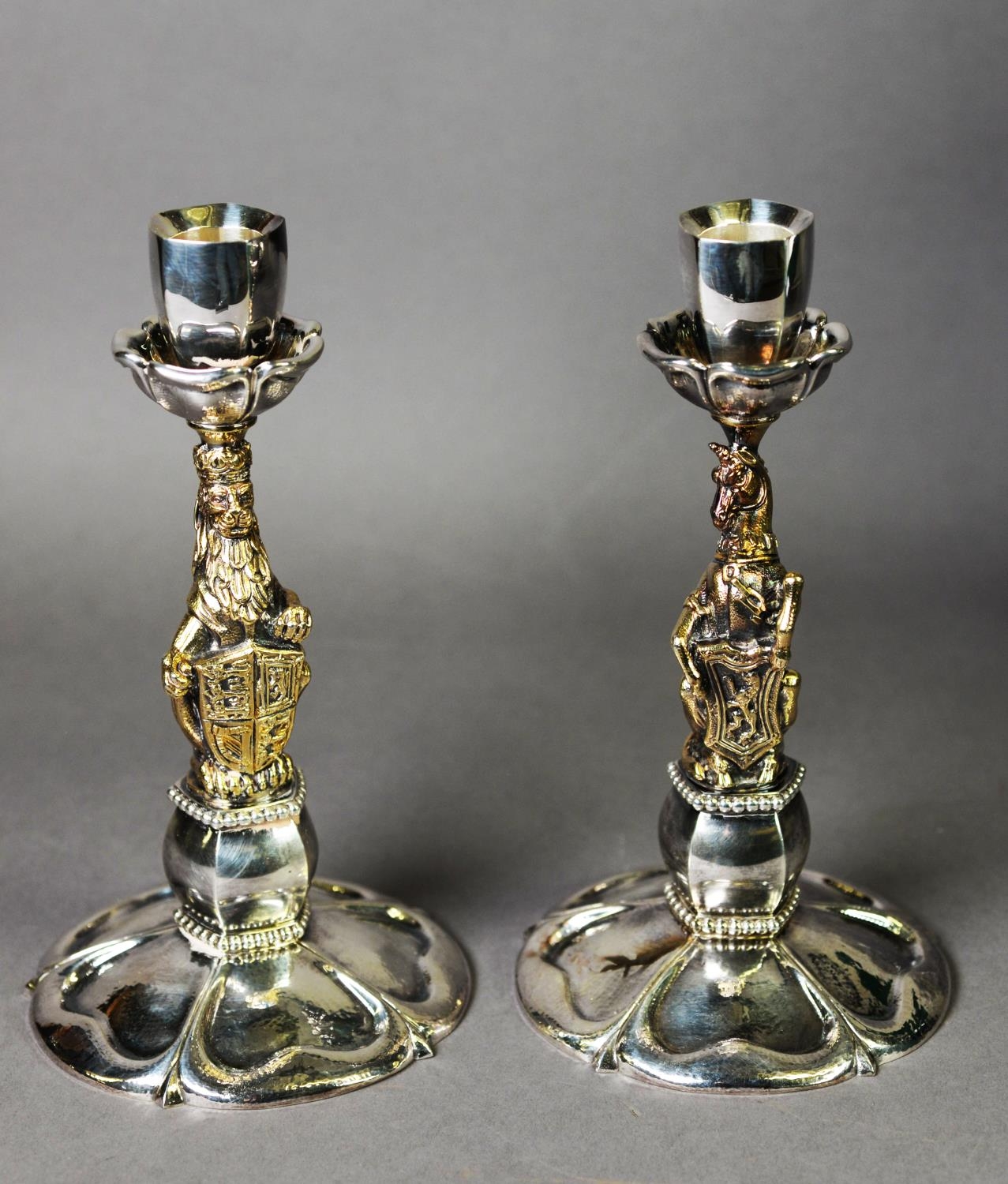 CASED PAIR OF LIMITED EDITION WEIGHTED SILVER AND GILT ‘QUEEN’S BEASTS CANDLESTICKS’ BY RICHARD
