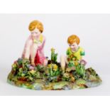 T. BAILEY FOR CROWN STAFFORDSHIRE, PORCELAIN GROUP MODELLED AS TWO YOUNG GIRLS PICKING FLOWERS,
