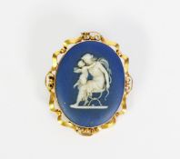 19th CENTURY WEDGWOOD BLUE AND WHITE JASPER WARE OVAL BROOCH depicting the Goddess Diana, seated