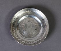 UNMARKED, FOREIGN ENGRAVED SILVER COLOURED METAL DISH SET WITH A MARIE THERESIA SILVER THALER, dated