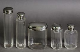 SET OF FIVE PANEL CUT GLASS TOILET BOTTLES with pull-off silver lids having reed and foliate sprig