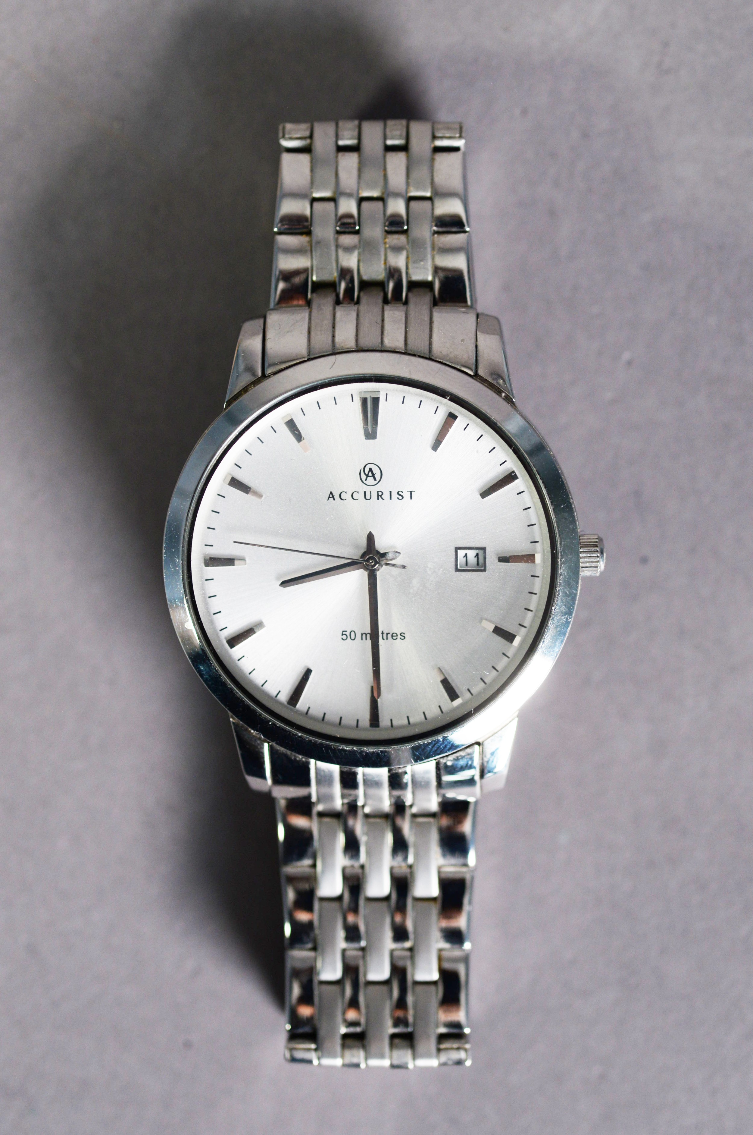 GENT'S ACCURIST QUARTZ ALL STAINLESS STEEL WRISTWATCH, water resistant to 50 metres, having silvered