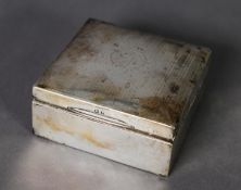 GEORGE V SILVER CASE TABLE CIGARETTE BOX, square, with engine turned top and hardwood lined