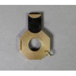 9ct GOLD ENGINE TURNED CIGAR CUTTER, ocatgon and flat, with suspension bale, 3.5cm wide,