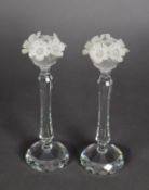 PAIR OF SWAROVSKI CUT CRYSTAL CANDLESTICKS, the sconces each with a garland of frosted glass