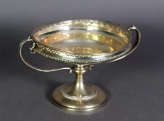 EDWARD VII TWO HANDLED PEDESTAL FRUIT DISH BY GOLDSMITHS & SILVERSMITHS Co Ltd, the shallow circular