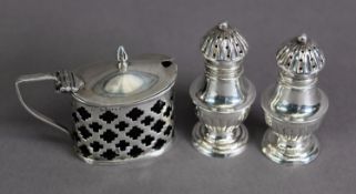 EDWARD VII PIERCED SILVER LIDDED MUSTARD, of oval form with angular scroll handle and blue glass