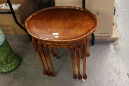 BEVAN FUNNELL ‘REPRODUX’ NEST OF THREE FIGURED WALNUT WOOD OVAL COFFEE TABLES, WITH SHAPED AND