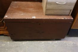 A BROWN PAINTED PINE BLANKET CHEST