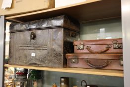 JAPANNED METAL TRUNK AND TWO SMALL LEATHER SUIT CASES (3)