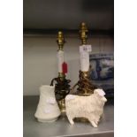 A PAIR OF CANDLESTICK STYLE BEDSIDE LAMPS, A POTTERY MODEL OF A RAM AND A PORTMERION PARIAN JUG (4)