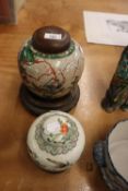 LARGE CRACKLE GLAZED GINGER JAR AND COVER, ON STAND AND ANOTHER SMALLER (2)