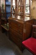 a 1960'S B & E OAK CHEST OF FIVE DRAWERS