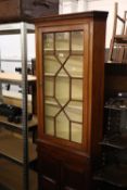 AN ANTIQUE OAK ASTRAGAL GLAZED CORNER CUPBOARD ON LATER TWO DOOR CUPBOARD BASE