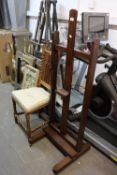 MID TWENTIETH CENTURY STAINED OAK EASEL, 56 1/2" (146cm) high