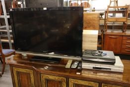 SONY FLAT SCREEN 40” TELEVISION, WITH REMOTE CONTROL, SONY DVD AND VIDEO PLAYER WITH REMOTE