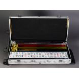 MAH JONG SET with bone and bamboo pieces, racks, etc., contained in a modern metal wheeled