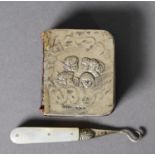 EDWARD VII EMBOSSED SILVER FRONTED SMALL PRAYER BOOK, decorated with cherubic faces, Birmingham