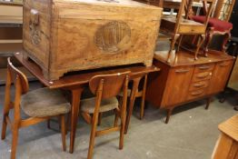 A 1970's TEAK DINING ROOM SUITE OF 8 PIECES, CONSISTING OF AN EXTENDING DINING TABLE, 6 CHAIRS,