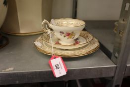 A PAIR OF NINETEENTH CENTURY FLORAL PAINTED DESSERT PLATES AND A CUP AND SAUCER TO MATCH (4)