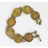 BRACELET COMPRISING 7 KING FARRUK 10 QUIRSH COINS, 1937 - 1939, chain linked, each 20mm in diameter,