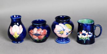 THREE WALTER MOORCROFT TUBE LINED SMALL POTTERY VASES, of varying shapes, comprising: TWO IN THE