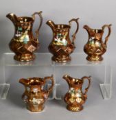 GRADUATED SET OF FOUR LATE VICTORIAN COPPER LUSTRE EARTHENWARE JUGS, the waisted necks hand-