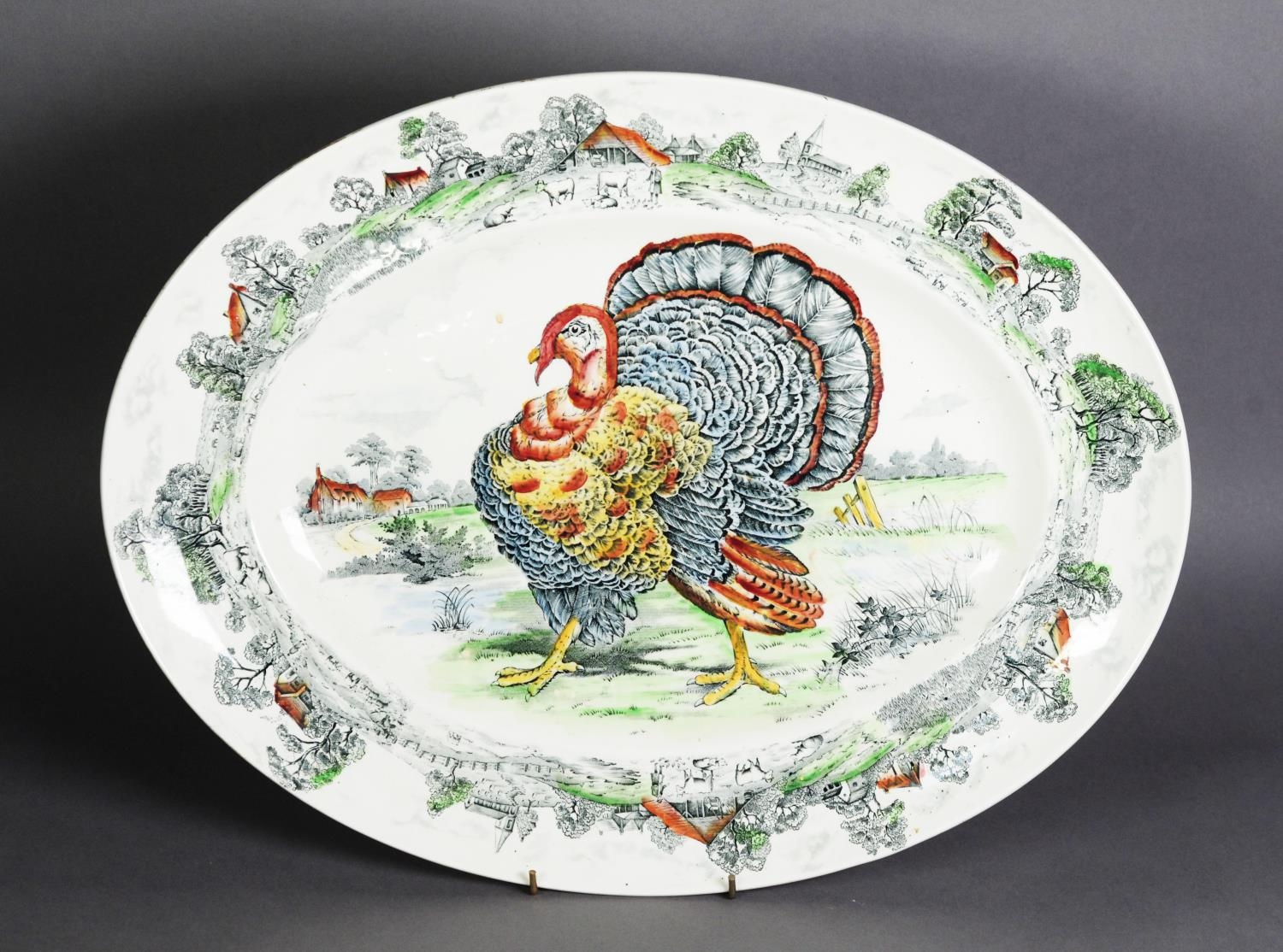 W R MIDWINTER ‘TURKEY’ PATTERN POTTERY OVAL MEAT PLATE, with printed and washed decoration, 20” x 15