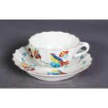 FIRST PERIOD WORCESTER PORCELAIN TEACUP AND SAUCER, each fluted and painted in bright enamels with