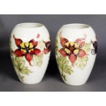 PAIR OF WALTER MOORCROFT ‘COLUMBINE’ PATTERN TUBE LINED POTTERY VASES, each of ovoid form, painted