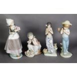 FOUR LLADRO PORCELAIN FIGURES OF CHILDREN WITH FLOWERS, including a Dutch girl with tulips and a boy