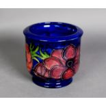 WALTER MOORCROFT ‘ANENOME’ PATTERN TUBE LINED POTTERY PLANTER, of footed cylindrical form, painted