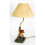 MODERN MONKEY PATTERN COMPOSITION TABLE LAMP, modelled dressed and standing, holding a bowl of