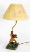 MODERN MONKEY PATTERN COMPOSITION TABLE LAMP, modelled dressed and standing, holding a bowl of