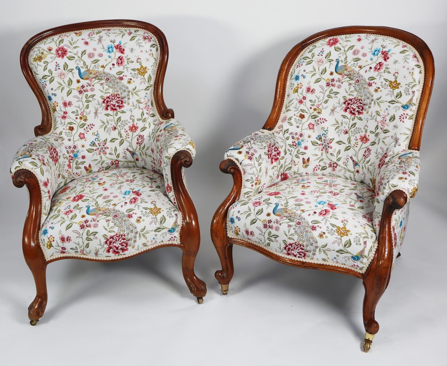 TWO SIMILAR VICTORIAN CARVED MAHOGANY GENT’S EASY ARMCHAIRS, each of typical form with show wood